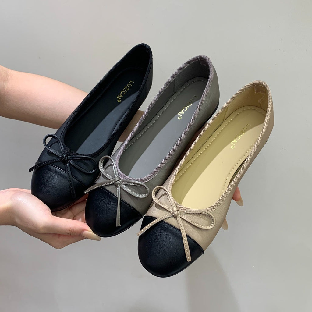 Svarta loafers med rosett