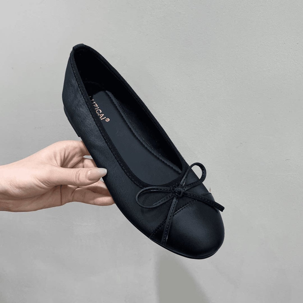 Svarta loafers med rosett